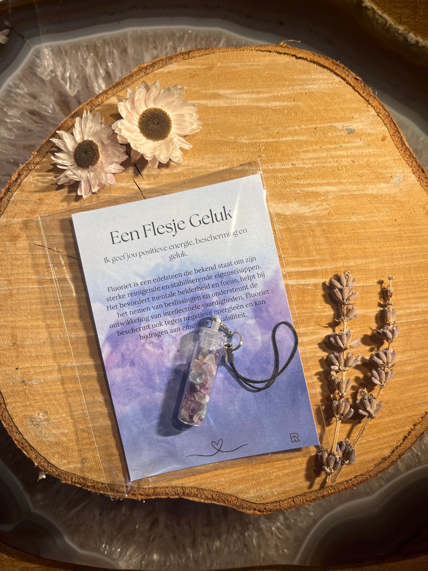 Fluoriet geluksflesje in zakje